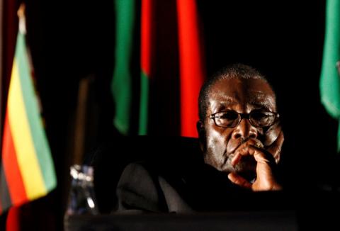 Former Zimbabwean President Robert Mugabe watches a video presentation during the summit of the Southern African Development Community (SADC) in Johannesburg, South Africa. PHOTO BY REUTERS/Mike Hutchings