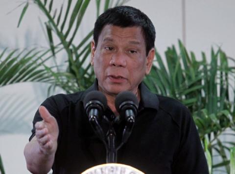 Philippines President Rodrigo Duterte gestures during a news conference upon his arrival from a state visit in Vietnam at the International Airport in Davao city, Philippines, September 30, 2016. PHOTO BY REUTERS/Lean Daval Jr