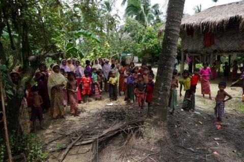 Rohingya villagers watch as international media visit Maung Hna Ma village, Buthidaung township, northern Rakhine state, Myanmar, July 14, 2017. PHOTO BY REUTERS/Simon Lewis