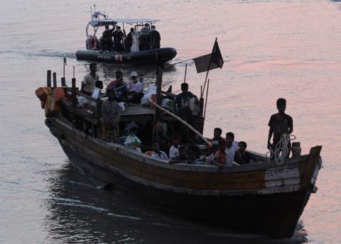 Rohingya refugees who were intercepted by Malaysian Maritime Enforcement Agency off Langkawi island, are escorted in their boat as they are handed over to immigration authorities, at the Kuala Kedah ferry jetty in Malaysia, April 3, 2018. PHOTO BY REUTERS/Stringer