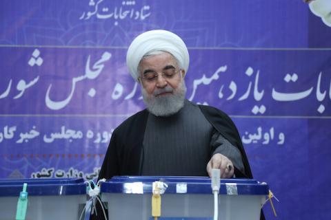 Iranian President Hassan Rouhani casts his vote at a polling station during parliamentary elections in Tehran, Iran, February 21, 2020. PHOTO BY Official Presidential website