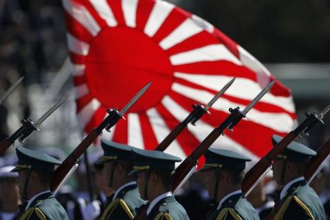 Japan Self-Defence Forces' (SDF) troops march during the annual SDF troop review ceremony at Asaka Base in Asaka, near Tokyo