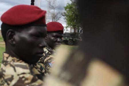 Sudan People's Liberation Army (SPLA) soldiers sit before the start of celebrations on the 31st anniversary of the SPLA in Juba, May 16, 2014. PHOTO BY REUTERS/Andreea Campeanu