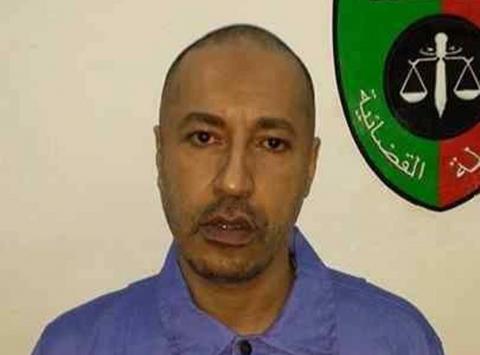 Saadi Gaddafi, son of Muammar Gaddafi, looks on inside a prison in Tripoli