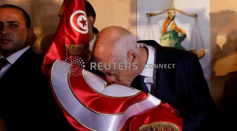 Tunisian presidential candidate Kais Saied reacts after exit poll results were announced in a second round runoff of the presidential election in Tunis, Tunisia, October 13, 2019. PHOTO BY REUTERS/Zoubeir Souissi