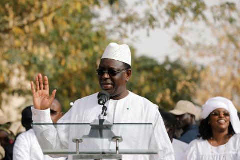 Senegal's President and a candidate for the upcoming presidential elections Macky Sall, speaks after casting his vote at a polling station as his wife Marem Faye Sall stands behind in Fatick, Senegal, February 24, 2019. PHOTO BY REUTERS/Zohra Bensemra