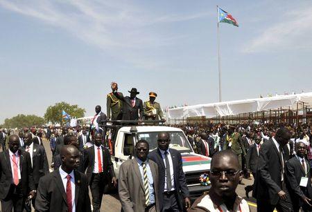 South Sudan's President Salva Kiir waves to the crowd atop a truck as he arrives at John Garang's Mausoleum to celebrate the 4th Independence Day in the capital Juba, July 9, 2015. PHOTO BY REUTERS/Jok Solomoun