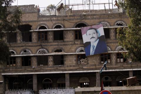 A picture of former Yemeni President Ali Abdullah Saleh hangs on a building of the Standing Committee of the General People's Congress, Saleh's party, in Sanaa