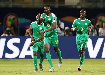 Senegal's Ismaila Sarr celebrates scoring their first goal with Saliou Ciss and Idriss Gueye. PHOTO BY REUTERS/Suhaib Salem