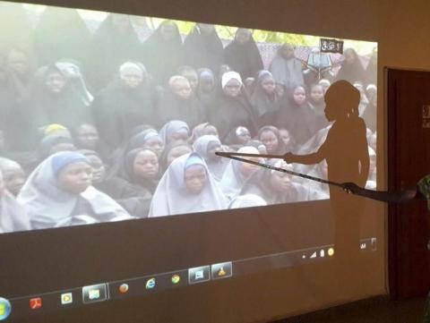 A student who escaped when Boko Haram rebels stormed a school and abducted schoolgirls, identifies her schoolmates from a video released by the Islamist rebel group at the Government House in Maiduguri, Borno State, May 15, 2014. PHOTO BY REUTERS/Stringer