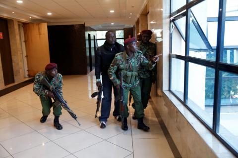 Members of security forces take up position at the scene where explosions and gunshots were heard at the Dusit hotel compound, in Nairobi, Kenya, January 15, 2019. PHOTO BY REUTERS/Baz Ratner