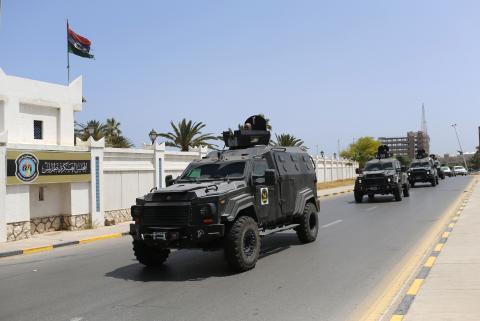 Libyan Security forces vehicles patrol to secure the area where Libya’s parliament members are meeting, at the Crown Prince's Palace in Tripoli