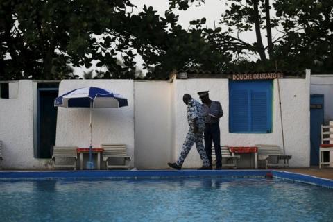 Security officers examine a hotel after an attack in Grand Bassam, Ivory Coast, March 13, 2016. PHOTO BY REUTERS/Joe Penney