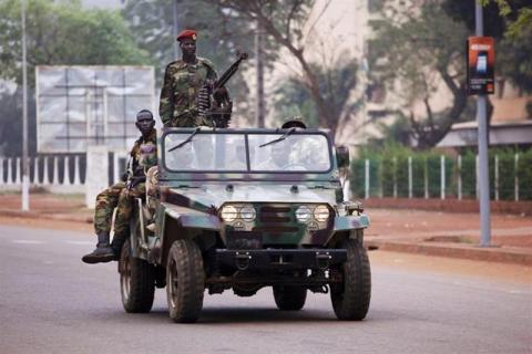 Seleka soldiers drive along a road in Bangui