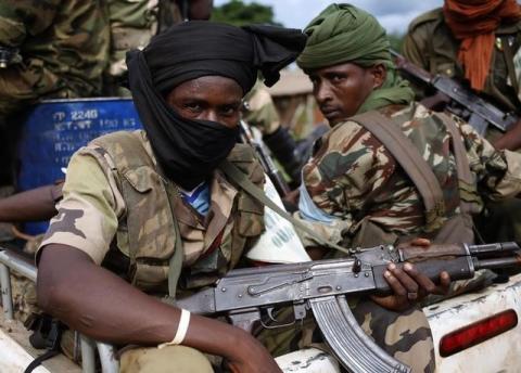 Seleka fighters sit in a vehicle in a village between Bambari and Grimari May 31, 2014. PHOTO BY REUTERS/Goran Tomasevic