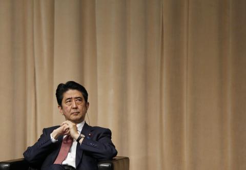 Japan's Prime Minister Shinzo Abe attends the Symposium of the 70th Anniversary of the United Nations, at the United Nations University in Tokyo, March 16, 2015. PHOTO BY REUTERS/Toru Hanai