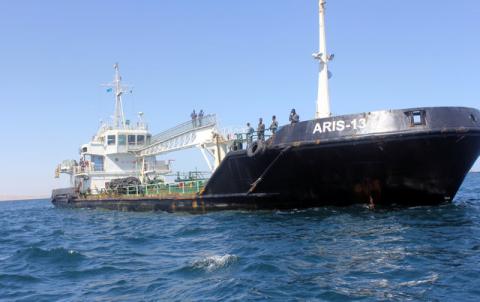 Maritime police are seen aboard oil tanker Aris-13, which was released by pirates, as it sails to dock on the shores of the Gulf of Aden in the city of Bosasso, northern Somalia's semi-autonomous region of Puntland, March 19, 2017. PHOTO BY REUTERS/Abdiqani Hassan