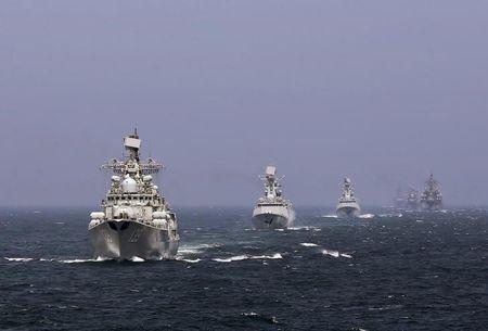 Chinese and Russian naval vessels participate in the Joint Sea-2014 naval drill outside Shanghai on the East China Sea, May 24, 2014. PHOTO BY REUTERS/China Daily