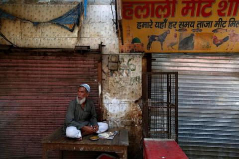 A muslim meat shop owner looks on outside his closed shop in Gurugram, Haryana, India, March 29, 2017. PHOTO BY REUTERS/Cathal McNaughton