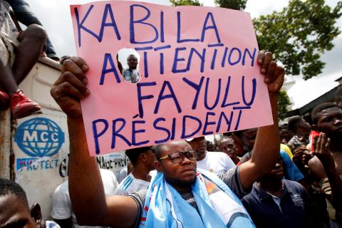 Supporters of the runner-up in Democratic Republic of Congo's presidential election, Martin Fayulu hold a sign before a political rally in Kinshasa, Democratic Republic of Congo, January 11, 2019. PHOTO BY REUTERS