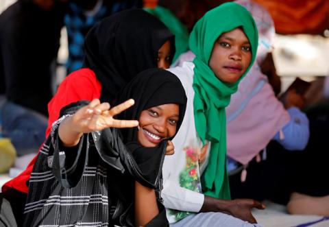 A protester makes a victory sign during a demonstration in front of the Defence Ministry in Khartoum, Sudan April 22, 2019. REUTERS/Umit Bektas