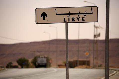 A road sign shows the direction of Libya near the border crossing at Dhiba, Tunisia, April 11, 2016. PHOTO BY REUTERS/Zohra Bensemra