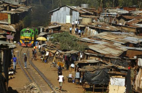 A train passes through the Kibera slum of Kenya's capital Nairobi, February 26, 2015. PHOTO BY REUTERS/Darrin Zammit Lupi 