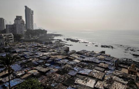 A view of a slum is seen along a seashore in Mumbai, India, November 28, 2019. PHOTO BY REUTERS/Prashant Waydande