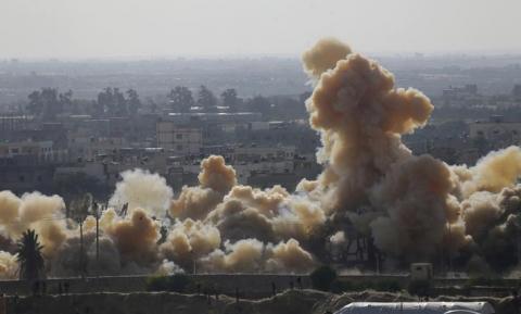 Smoke rises as a house is blown up during a military operation by Egyptian security forces in the Egyptian city of Rafah, near the border with southern Gaza Strip, November 3, 2014. PHOTO BY REUTERS/Ibraheem Abu Mustafa