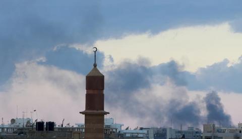 Smoke billows in the sky after heavy fighting broke out near the seaport in eastern Benghazi city, November 3, 2014. PHOTO BY REUTERS/Esam Omran Al-Fetori