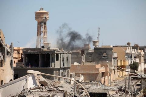 Smoke rises following what witnesses said was an air strike during a battle between Libyan forces allied with the U.N.-backed government and Islamic State militants in Sirte, Libya, September 7, 2016. PHOTO BY REUTERS/Hani Amara