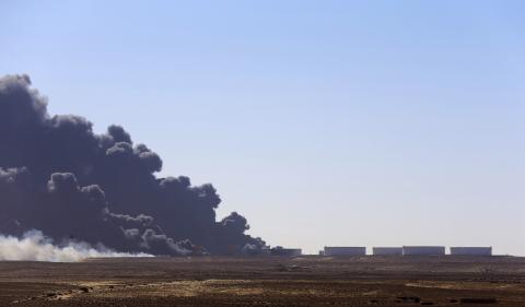 Black smoke billows out of a storage oil tank at the port of Es Sider in Ras Lanuf, December 28, 2014. PHOTO BY REUTERS/Stringer