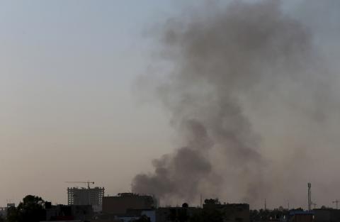 Black smoke raises into the air near Benghazi port, where there are violent clashes, in Benghazi, February 7, 2015. PHOTO BY REUTERS/Esam Omran Al-Fetori