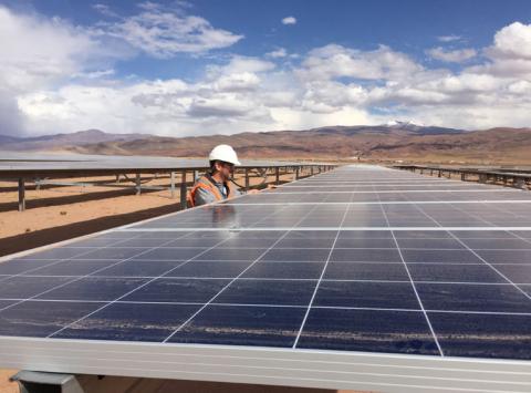 Guillermo Giralt, technical director of Cauchari Solar, stands next to solar panels at a solar farm, built on the back of funding and technology from China, in Salar de Cauchari, Argentina, April 3, 2019. PHOTO BY REUTERS/Miguel Lobianco