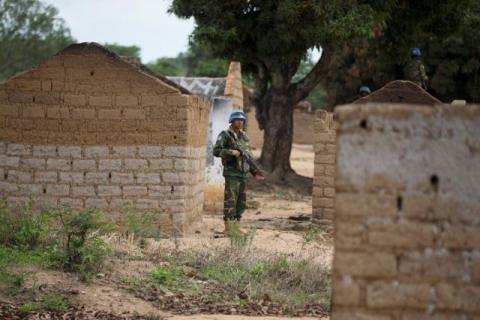 A Bangladeshi United Nations peacekeeping soldier stands among houses destroyed by violence in September, in the abandoned village of Yade, Central African Republic, April 27, 2017. PHOTO BY REUTERS/Baz Ratner