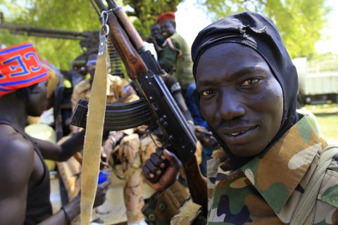 A South Sudan army soldier holds his weapon in Bor, 180 km (108 miles) northwest from capital Juba