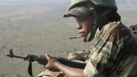 A female Cameroonian soldier stands guard at an observation post on a hill in the Mandara Mountain chain in Mabass, overlooking Nigeria, northern Cameroon, February 16, 2015. PHOTO BY REUTERS/Bate Felix Tabi Tabe