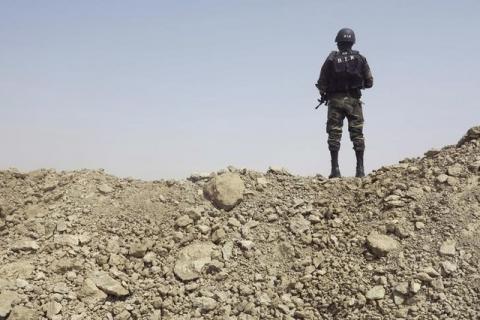 A Cameroonian special forces soldier stands guard on top of trenches that fortify the northern entrance of Fotokol, February 17, 2015. PHOTO BY REUTERS/Bate Felix Tabi Tabe