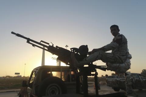 A Libyan military personnel mans a checkpoint in the city center in Benghazi December 4, 2014, where clashes between pro and anti-government forces have taken place. PHOTO BY REUTERS/Stringer