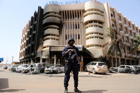 A soldier stands guard in front of Splendid Hotel in Ouagadougou, Burkina Faso, January 17, 2016, a day after security forces retook the hotel from al Qaeda fighters who seized it in an assault that killed two dozen people from at least 18 countries and marked a major escalation of Islamist militancy in West Africa. PHOTO BY REUTERS/Joe Penney