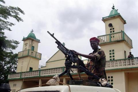 Soldiers from the Seleka rebel alliance stand guard as the Central African Republic's new President Michel Djotodia (not pictured) attends Friday prayers