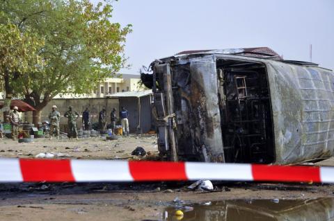 Soldiers are seen at the scene of a suicide bombing at a bus station in Kano, February 24, 2015. PHOTO BY REUTERS/Stringer