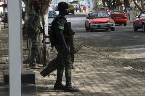 GRAND BASSAM, Ivory Coast (Reuters) - Ivory Coast soldiers armed with assault rifles patrolled the deserted beaches of a resort town on Monday, a day after gunmen from al Qaeda's North African branch killed 18 people, the third major al Qaeda attack in West Africa in four months.  President Alassane Ouattara declared three days of mourning for the country, which has never before been hit by al Qaeda.  Al Qaeda in the Islamic Maghreb (AQIM) said it was responsible for storming the beach hotels in Grand Bassa