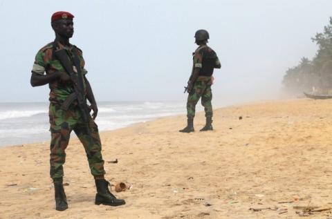 Soldiers stand guard on the beach following an attack by gunmen from al Qaeda's North African, in Grand Bassam, Ivory Coast, March 14, 2016. PHOTO BY REUTERS/Luc Gnago