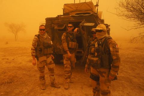 French soldiers from Operation Barkhane stand outside their armored personnel carrier during a sandstorm in Inat, Mali, May 26, 2016. PHOTO BY REUTERS/Media Coulibaly