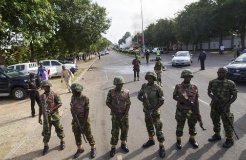 Nigerian army soldiers stand guard in Abuja, June 25, 2014. PHOTO BY REUTERS/Afolabi Sotunde