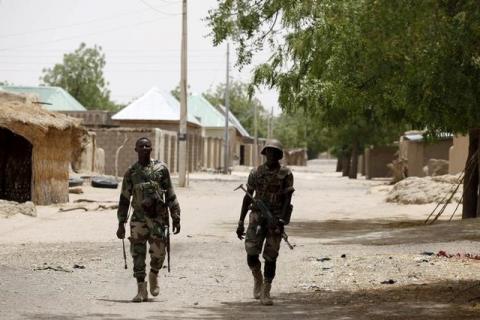 Nigerien soldiers patrol on foot in Damasak. PHOTO BY REUTERS/Joe Penney