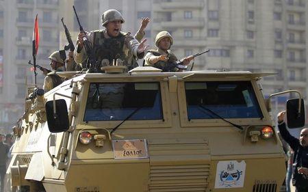 Army soldiers take their positions with their armoured personnel vehicle in the Cairo suburb of Matariya, November 28, 2014. PHOTO BY REUTERS/Mohamed Abd El Ghany