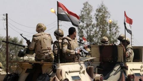 Soldiers in military vehicles proceed towards the al-Jura district in El-Arish city from Sheikh Zuwaid, around 350 km (217 miles) northeast of Cairo, May 21, 2013. PHOTO BY REUTERS/Stringer