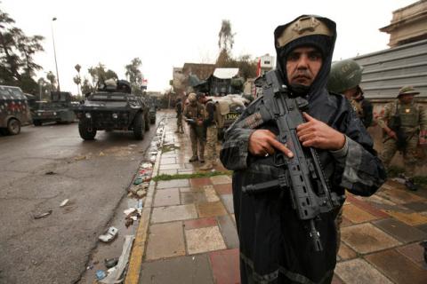 A member of Iraqi rapid response forces poses with his gun during clashes with Islamic State militants in Mosul, Iraq, March 13, 2017. PHOTO BY REUTERS/Azad Lashkari